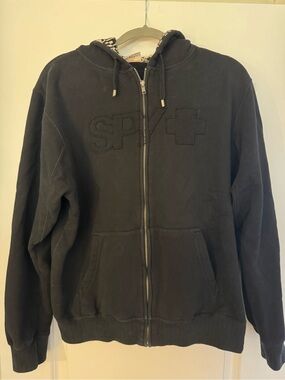 SPY Black Hoodie with White Graphic Lining and Orange Tag
